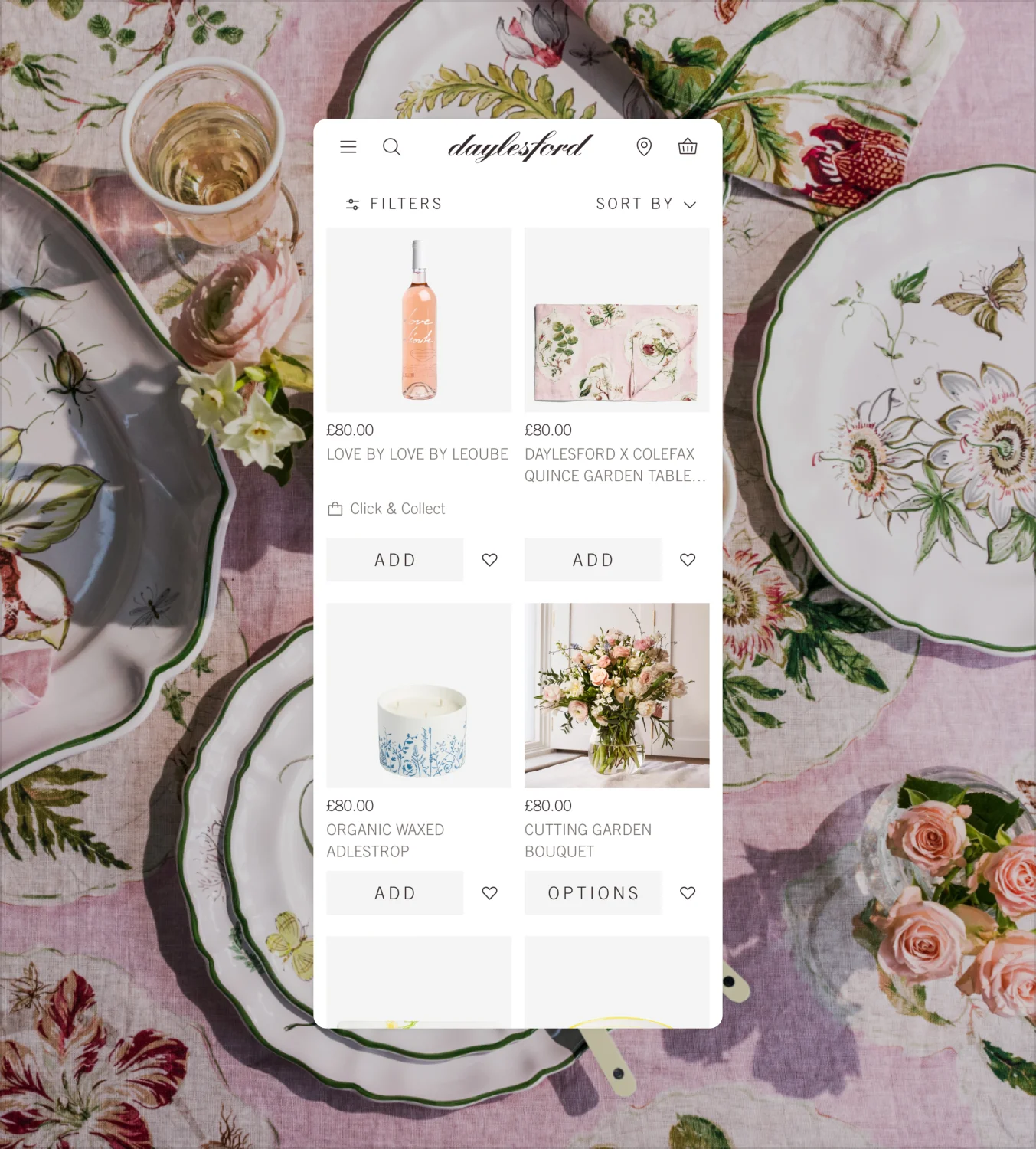 Daylesford mobile app product page with elegant table setting and organic wine selection